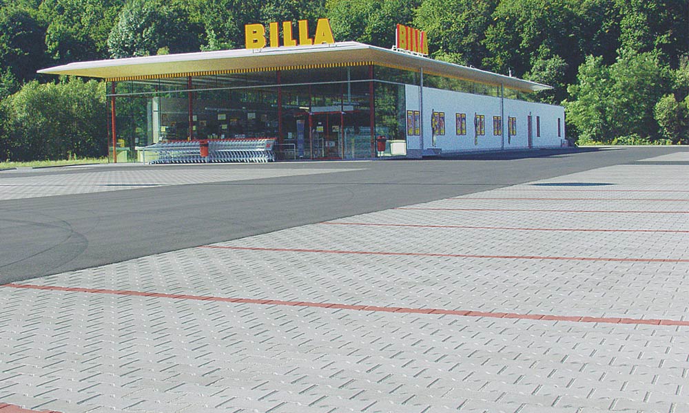 Duplakötésű kő, szürke és téglavörös parkolóhely jelöléséhez Duplakötésű kő, szürke és téglavörös parkolóhely jelöléséhez